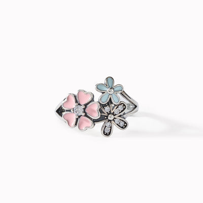 DELICATE FLOWER RING-GROW IN DIFFERENT DIRECTION BUT ROOTS REMAIN AS ONE