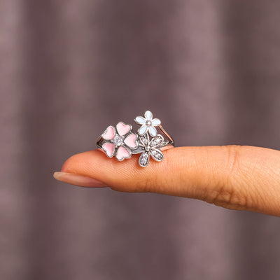 DELICATE FLOWER RING-GROW IN DIFFERENT DIRECTION BUT ROOTS REMAIN AS ONE